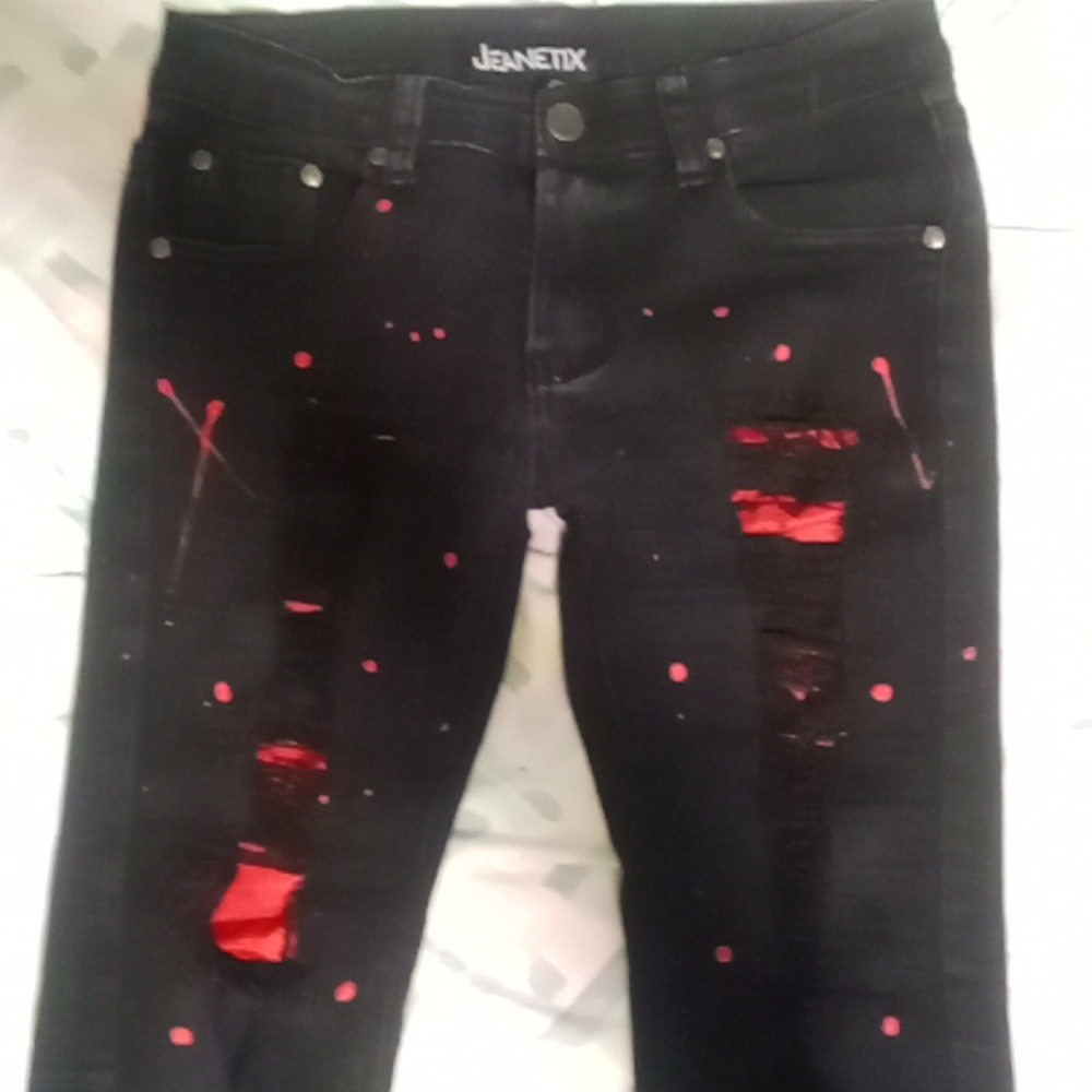 Red and black ripped jeans